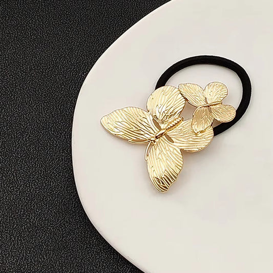 Cola de Caballo con Mariposa Dorada – Accesorio Metálico Elegante para el Cabello